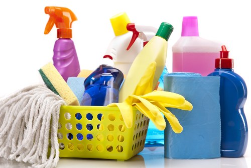 Professional cleaner working in a bright Knightsbridge living room