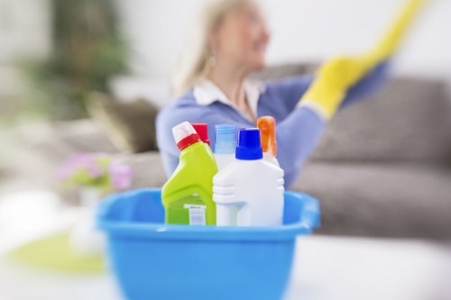 Local cleaner working on apartment windows in Knightsbridge