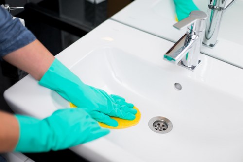 Deep cleaning a modern kitchen in a Knightsbridge rental property